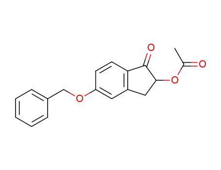 5-(benzyloxy)-2,3-dihydro-1-oxo-1H-inden-2-yl acetate